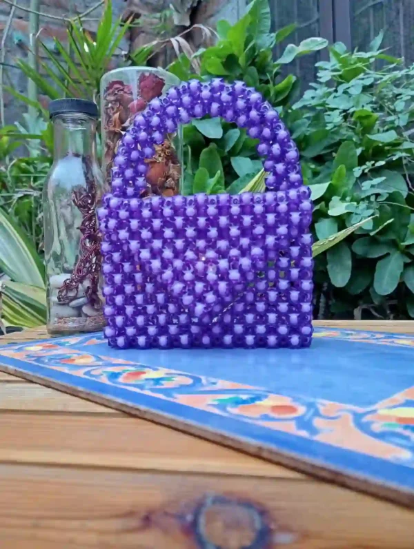 Handcrafted purple mini beaded handbag with glossy finish