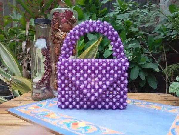 Stylish handmade purple beaded bag for casual or party use