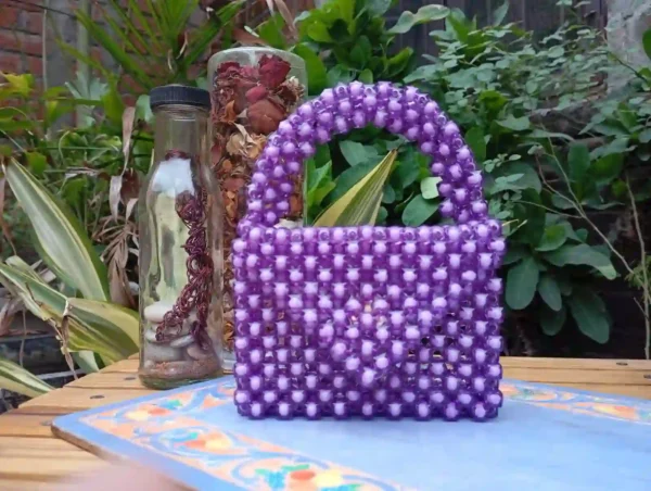Compact handcrafted purple beaded purse for women